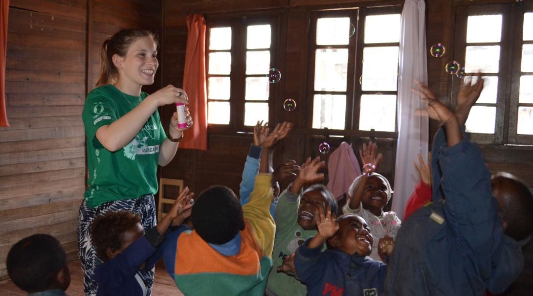 Fundraising is one way of financing your trip to Madagascar. A volunteer is having fun with children in Madagascar after she fundraised her trip to this African country.